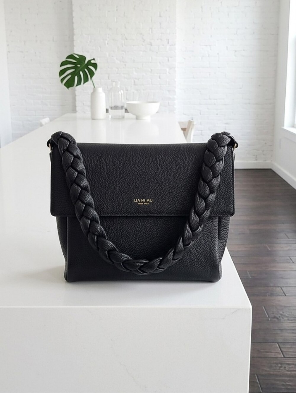 Lia Numa Italy," "Pebbled Leather," "Braided Shoulder Strap," "Dollaro Leather,"